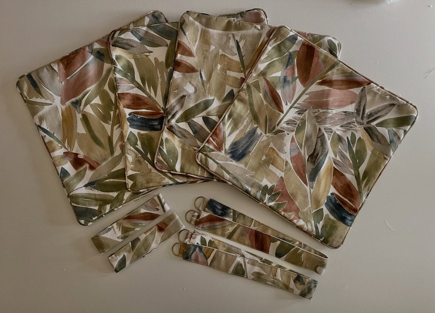 Finishing touches - piped cushion covers and two different pairs of tie-bands, one pair hook and loop tape and the other d-rings (because tie back hooks were already in place). 🪝  Fabric is Kyoto Acer bamboo from @prestigioustextiles. 🧵  It is 100% printed cotton and is available in four other colour ways; papaya, pampas, midnight and plum. ✂️